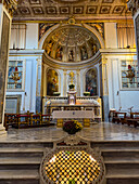 Main altar & altarpiece in the apse of the Basilica of Sant'Antonino, Sorrento, Italy. In front is a viewing window into the crypt below.