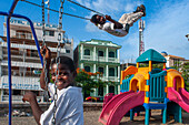 Chindren playing in the children's playground in Jacmel town square in Jacmel city center, Haiti