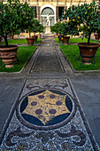 Mosaic designs in the walkway in the gardens of the Palazzo Medici Riccardi. Florence, Italy.