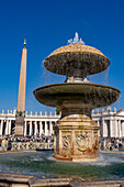 The Bernini Fountain in St. Peter's Square in Vatican City in Rome, Italy. Behind is the Vatican Obelisk.