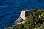 A medieval Saracen watch tower on the a headland on the Amalfi Coast at Praiano, Italy.