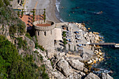 A Saracen tower on a beach of Conca dei Marini on the Amalfi Coast of Italy.