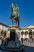 Equestrian statue of Grand Duke Ferdinando I de' Medici. Piazza Santissima Annunciata, Florence, Italy. Behind is the Basilica della Santissima Annunziata.