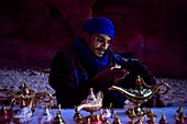 Portrait of a bedouin souvenirs seller at The Treasury, Al Khazneh, at night, Petra, Jordan.