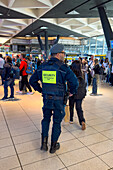 An armed security guard in the Central Train Station in Naples, Italy.