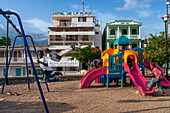 Chindren playing in the children's playground in Jacmel town square in Jacmel city center, Haiti