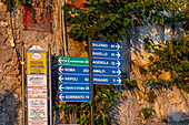 Roadsigns on SS163, the Amalfi Coast road, in the town of Positano, Italy.