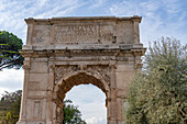 East aspect of the Arch of Titus in the Roman Forum in the Colosseum Archaeological Park, Rome, Italy.