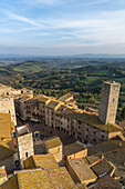 Torre dei Becci overlooks the Piazza della Cisterna in the medieval walled city of San Gimignano, Italy.