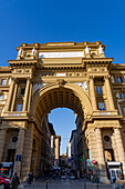 Via degli Strozz enters Piazza della Repubblica through Palazzo dell' Arcone di Piazza. Florence, Italy