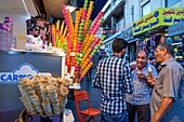 Multicoloured ice cream cones shop, a traditional street food seen for sale near the Roman Theatre, in the Old Town of Amman, Jordan.