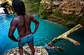 Exploring the cobalt waters of Bassin Bleu waterfall composed of bassin yes, bassin palmiste and bassin clair, Maire de Jacmel, Jacmel, Haiti