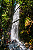 Haiti Voodoo Festival in Saut d'Eau, in Saut d'Eau, Ville Bonheur, Haiti. Thousands of both Vodou and Catholic followers gathered under the Saut d'Eau waterfall in Haiti. The pilgrimage, made by Voodou practitioners and Catholics alike, originated with the sighting of the likeness of the Virgin Mary on a palm leaf close to the falls half a century ago. Catholism and Voodou practices are forever intertwined in its Haitian form. The appearance of a rainbow beneath the falls is said indicate that Danbala - the great lord of the waterfall - and Ayida Wedo - the rainbow - are making love. Fertility