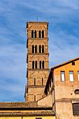 Romanesque bell tower of the Basilica of Santa Francesca Romana in the Colosseum Archaeological Park. Rome, Italy.