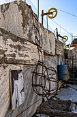 A vintage wire ladder used by miners in the quarries. Fantiscritti Quarry Museum, Carrara, Italy. At left is a vintage photo of one in use.