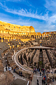 Interior of the Roman Colosseum or Flavian Amphitheater with golden sunset light in Rome, Italy. The tunnels under the floor of the arena were called hypogeum.