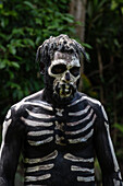 The Skeleton Men from the Omo Bugamo tribe of Papua New Guinea paint their bodies with black and white paint emulating the human skeleton, Chimbu Province, Papua New Guinea