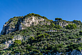 A luxury villa below the limestone cliffs on the west coast of the island of Capri, Italy.