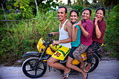 Local people, fanny many people driving a motorcyce in Sipaway Island, San Carlos City, Negros Occidental, Philippines