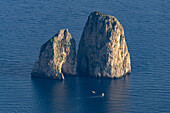 The Farallon Islands or faraglioni, sea stacks off the coast of the island of Capri, Italy, viewed from Monte Solaro.