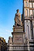 Statue of Dante Alighieri in the Piazza Santa Croce, beside the Basilica of Santa Croce in Florence, Italy.