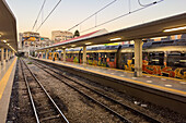 Passenger train painted with a graffit theme at the regional train platform in the Central Train Station in Naples, Italy.