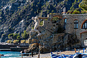 Il Gigante, the Giant of Villa Pastine, a statue on the shore of Monterosso al Mare, Cinque Terre, Italy.