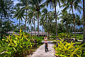 Bicycle tour inside the The residence luxury resort, Bintan island, Riau islands, Indonesia