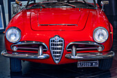 Detail of a 1960s Alfa Romeo Giulia Spyder in a studio in Sorrento, Italy. This car was produced from 1962-1965.