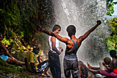 Haiti Voodoo Festival in Saut d'Eau, in Saut d'Eau, Ville Bonheur, Haiti. Thousands of both Vodou and Catholic followers gathered under the Saut d'Eau waterfall in Haiti. The pilgrimage, made by Voodou practitioners and Catholics alike, originated with the sighting of the likeness of the Virgin Mary on a palm leaf close to the falls half a century ago. Catholism and Voodou practices are forever intertwined in its Haitian form. The appearance of a rainbow beneath the falls is said indicate that Danbala - the great lord of the waterfall - and Ayida Wedo - the rainbow - are making love. Fertility