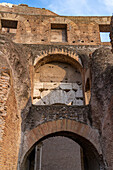 Detail of the stonework inside the Roman Colosseum or Flavian Amphitheater in Rome, Italy.