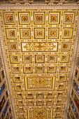 The ornate ceiling of the central nave of the Basilica of St. Paul Outside the Walls, Rome, Italy.