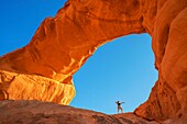 Hiking at rock-arch Al Kharza or Al Borg Alsagheer Wadi Rum, Jordan