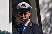 A friendly policeman in uniform in the resort town of Anacapri on the island of Capri, Italy.