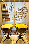 A collection of antique percussion instruments in the Accademia Gallery in Florence, Italy. Includes kettle-drums or tympani, triangles, castanets, jingles and xylophones.