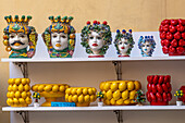 Ceramic Moorish heads and lemon bowls for sale in the Campaniadamare shop in Sorrento, Italy.