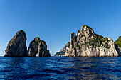 The Farallons or faraglioni, sea stacks off the coast of the island of Capri, Italy. L-R: Scopolo or Fuori, Mezzo with its sea arch & Stella.