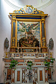 An altarpiece of a side chapel with St. Michael the Archangel in the 11th Century Ravello Duomo in Ravello, Italy.