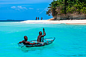 Fishermen in the waterfront beach in Île-à-Vache, Sud Province, Haiti