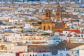 San Lorenzo and Omniun Sanctorum towers among Seville's charming architecture and city rooftops.