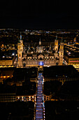 Aerial view of the Cathedral Basilica of Our Lady of the Pillar and Alfonso Street illuminated at night during Christmas, Zaragoza, Spain