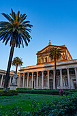 The statue of St. Paul and facade of the Basilica of St. Paul Outside the Walls, Rome, Italy.