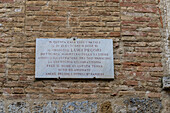 Marble plaque on the Luigi Pecori house on Via San Matteo in the medieval city of San Gimignano, Italy. Pecori was a historian in the 1800s who wrote the first history of the city of San Gimignano.