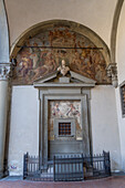 Fresco & bust on the wall of the portico of the Hospital of the Innocents or Foundling Hospital in Florence, Italy. Through this grate, infants could be passed to be put into the care of the hospital.