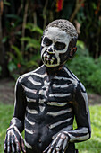 The Skeleton Men from the Omo Bugamo tribe of Papua New Guinea paint their bodies with black and white paint emulating the human skeleton, Chimbu Province, Papua New Guinea