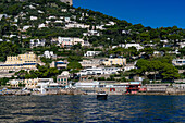 The seaside resort town of Marina Piccola by the Tyrrhenian Sea on the island of Capri, Italy. The large Hotel Weber Ambassador is at left.