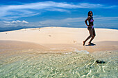 Tourists in a Isolated island uninhabited white sand beach, Île-à-Vache, Sud Province, Haiti