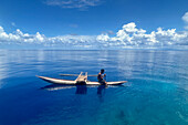 Resident of Vitu Islands in their traditional dugout canoes, Lama Anchorage, New Britain, Papua New Guinea