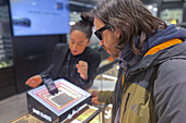 Man trying Ray-Ban Meta Smart AI glasses in El Corte Ingles store of Zaragoza, Spain