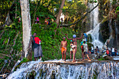 Haiti Voodoo Festival in Saut d'Eau, in Saut d'Eau, Ville Bonheur, Haiti. Thousands of both Vodou and Catholic followers gathered under the Saut d'Eau waterfall in Haiti. The pilgrimage, made by Voodou practitioners and Catholics alike, originated with the sighting of the likeness of the Virgin Mary on a palm leaf close to the falls half a century ago. Catholism and Voodou practices are forever intertwined in its Haitian form. The appearance of a rainbow beneath the falls is said indicate that Danbala - the great lord of the waterfall - and Ayida Wedo - the rainbow - are making love. Fertility